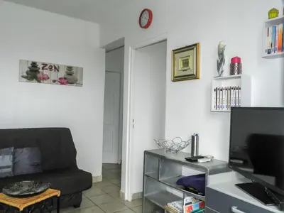 a living room with a couch and a tv at Holiday Home Cavoni by Interhome in Moriani Plage