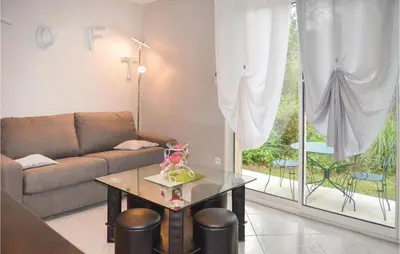 a living room with a couch and a table at Nice Home In Ville Di Paraso With Wifi in Ville-di-Paraso