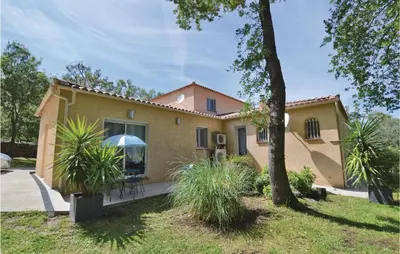 a house with a patio in front of it at Nice Home In Ville Di Paraso With Wifi in Ville-di-Paraso