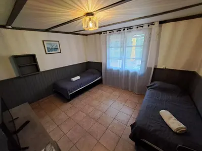 a kitchen with a white refrigerator and a sink at Bungalows Filippi in Porto-Vecchio