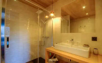 a bathroom with a sink and a shower at Au pied des oliviers in Calenzana