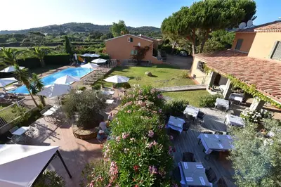 an aerial view of a villa with a swimming pool at Hôtel Les Lentisques in Cargèse