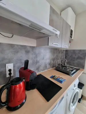 a kitchen with a red appliance on a counter at chez dume in Bonifacio