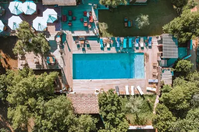 an overhead view of a swimming pool in a house at Le Maquis Plage Corse in Poggio-Mezzana