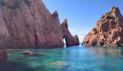 a large body of water with some rocks in it at Résidence Le Porto in Porto Ota