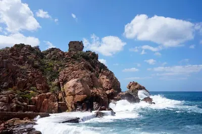 a rocky island with a castle on top of it at Résidence Le Porto in Porto Ota