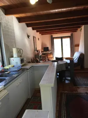a kitchen with a sink and a counter top at Petite maison proche de la nature in Vico