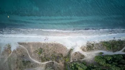 an aerial view of the ocean and a beach at Casa e Natura in Moriani Plage