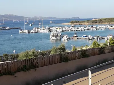 a view of a marina with boats in the water at Hôtel du Golfe in Bonifacio