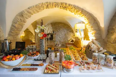 a buffet of food on a table in a room at Hôtel La Dimora & Spa in Saint-Florent