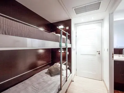 a bedroom with a bunk bed and a door at Apartment Cala Sultana-3 by Interhome in Usciolo