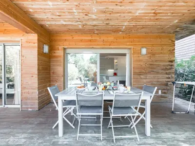 a white table and chairs on a patio at Apartment Cala Sultana-7 by Interhome in Usciolo