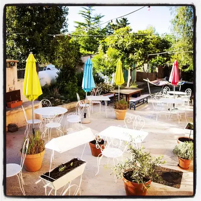a group of tables and chairs with umbrellas at Chez Marie in Linguizzetta