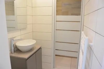 a bathroom with a sink and a mirror at Emma in Sari Solenzara