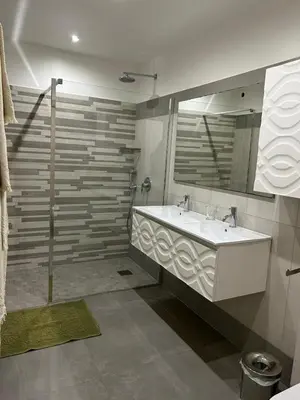 a bathroom with a sink and a mirror at La villa Serena in Bonifacio