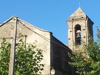 an old building with a bell tower on top of it at English Club in Corsica A in Porri