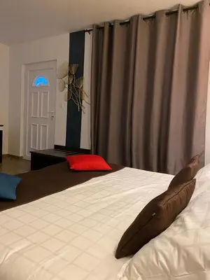a bedroom with a bed with a stuffed shark on it at Mariana Plage in La Marana