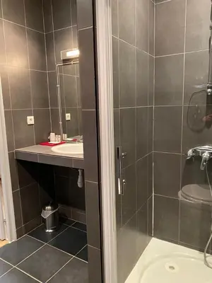 a bathroom with a shower and a sink at Mariana Plage in La Marana
