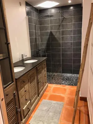 a bathroom with two sinks and a shower at Villa Rosa in Conca