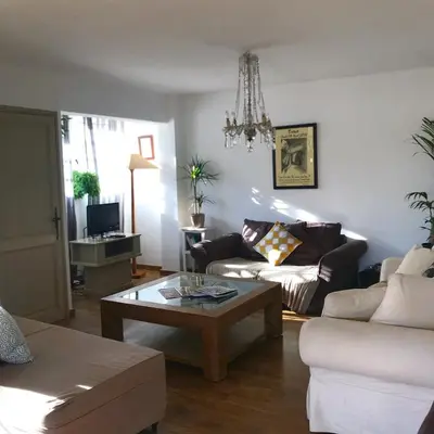 a living room with a couch and a coffee table at Duplex vue mer in Sagone