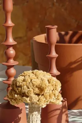 a vase with a bouquet of flowers on a table at Residenza l 'Alivetu in Cargèse