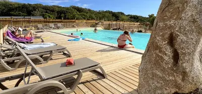 a group of people in a swimming pool at Camping Kévano Plage in Pianottoli-Caldarello