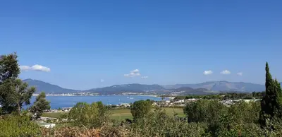 a view of a lake with mountains in the background at Vista Mare in Porticcio