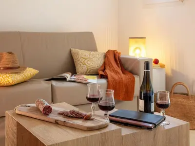 a living room with wine glasses and a couch at Apartment MB6 Loggia by Interhome in Moriani Plage