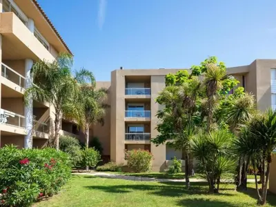 a swimming pool with a view of the ocean at Apartment MB4 Loggia by Interhome in Moriani Plage
