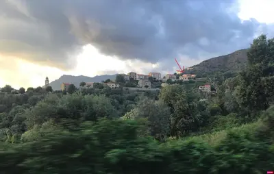 a town on top of a hill with trees at U Parasu in Santa-Maria-Figaniella