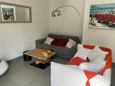 a living room with a couch and a table at Villa Orethaga Piscine 10 pers porto Vecchio in Porto-Vecchio