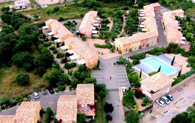 an aerial view of a resort with a pool at CYRNOS in Porto-Vecchio