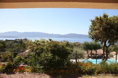a view from the garden of a house with a swimming pool at Résidence Ogliastrello in Olmeto