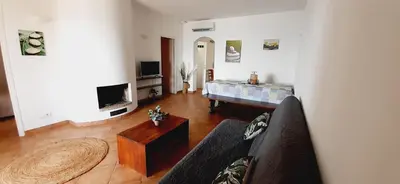 a living room with a couch and a coffee table at Résidence Pascal Paoli Fior di Mare in Moriani Plage