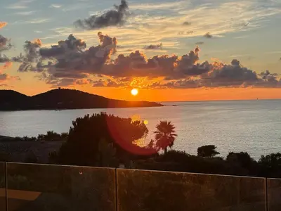a sunset over the ocean with the sun in the sky at A Casa Nostra in Coti-Chiavari