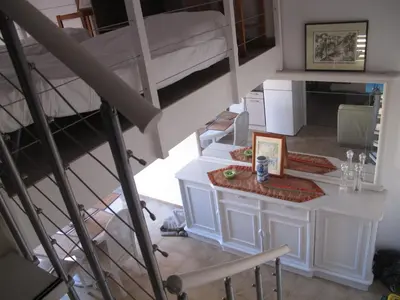 an overhead view of a room with a bunk bed at MARE BELLU AGOSTA PLAGE in Albitreccia