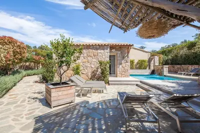 an outdoor patio with chairs and a swimming pool at la villa piana Ardiadoro in Bocca del Oro