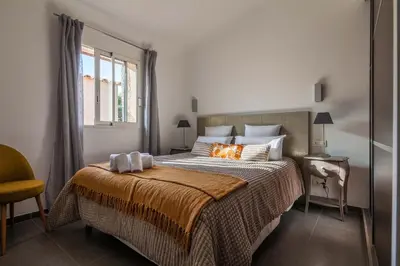 a bedroom with a large bed with pillows on it at la villa piana Ardiadoro in Bocca del Oro