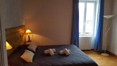 a bedroom with two teddy bears on a bed at U San Larenzu in Aullène