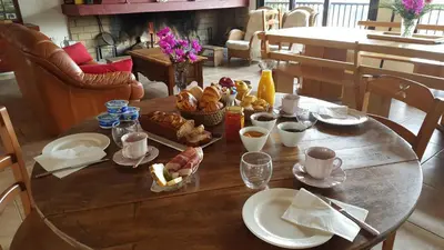 a wooden table with food on top of it at U San Larenzu in Aullène