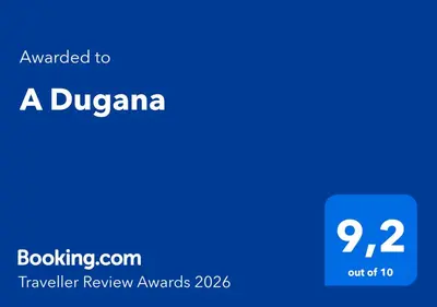a blue screen with the text awarded to a dubrovka traveler review awards at A Dugana in Lecci