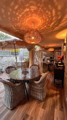 a dining room with a table and chairs at Chez Virginie in Porto-Vecchio
