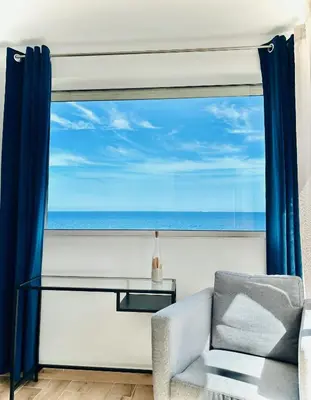 a living room with a view of the ocean at Residence Canella in Sari Solenzara