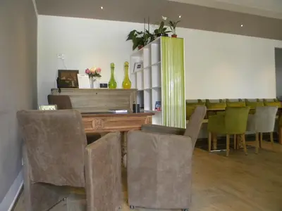 a dining room with a table and some chairs at Auberge les Oliviers in Lucciana