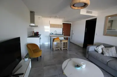 a living room with a couch and a table at Domaine du Frasso in Grosseto-Prugna