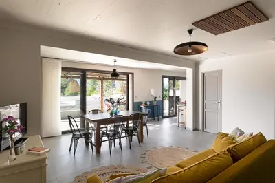 a living room with a couch and a table at Résidence I Levri in Porto-Vecchio