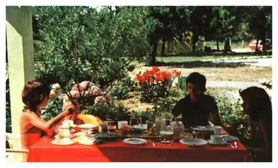 a group of people sitting at a table at Domaine de l'Avidanella in Santa-Lucia-di-Moriani