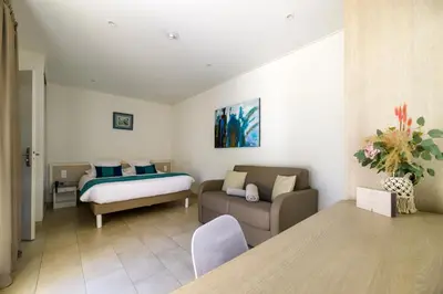 a living room with a bed and a couch at Hotel & Restaurant San Pellegrino in Folelli