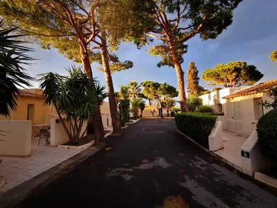 a street in a villa with trees and bushes at Hotel & Restaurant San Pellegrino in Folelli