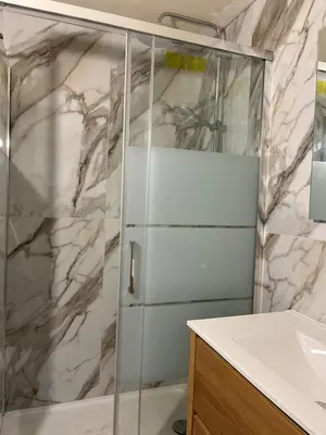 a bathroom with a shower and a sink at Maison Le Citronnier avec piscine - Domaine E Case Di Cuttoli in Cuttoli-Corticchiato